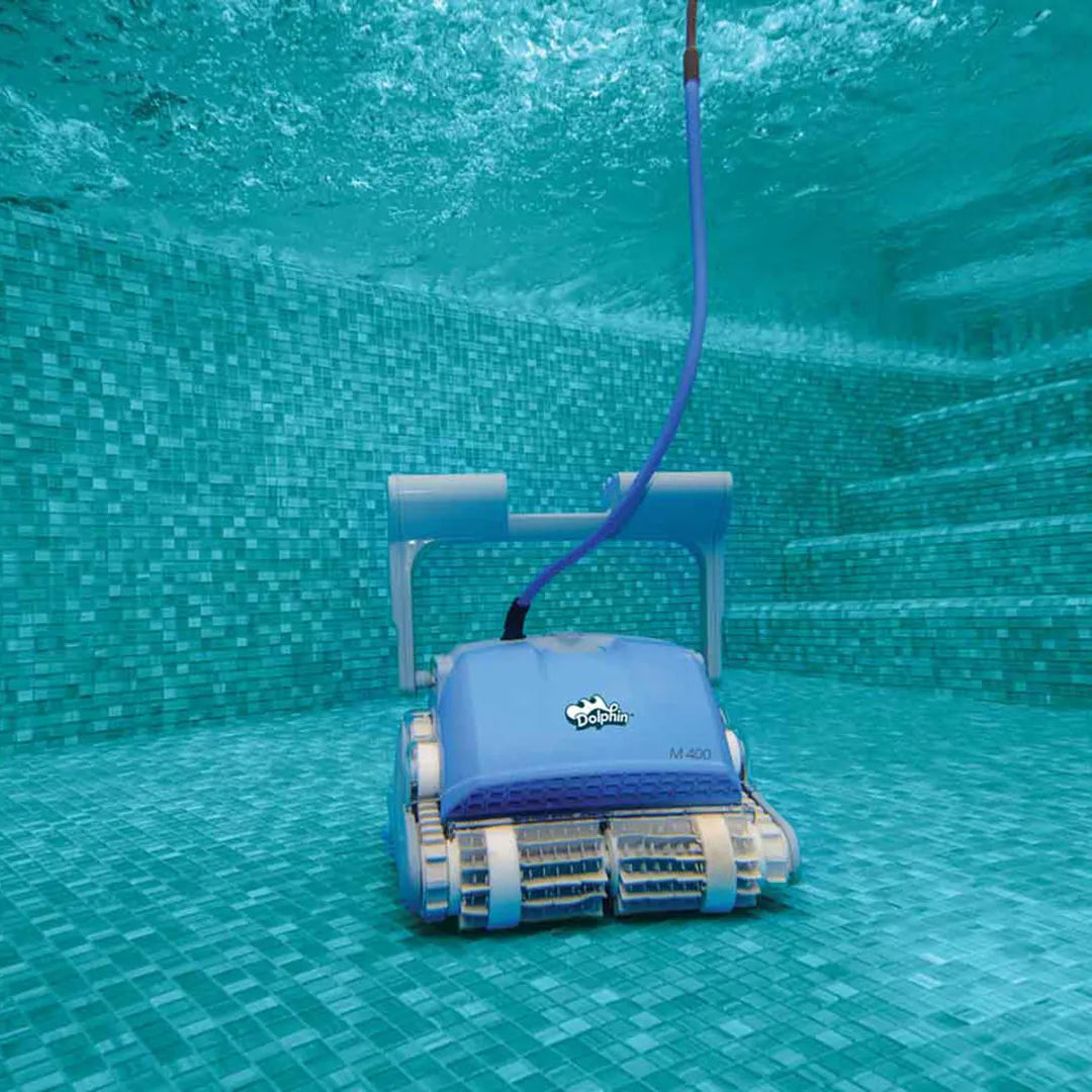Dolphin M400 Deluxe robotic pool cleaner cleaning a tiled pool floor