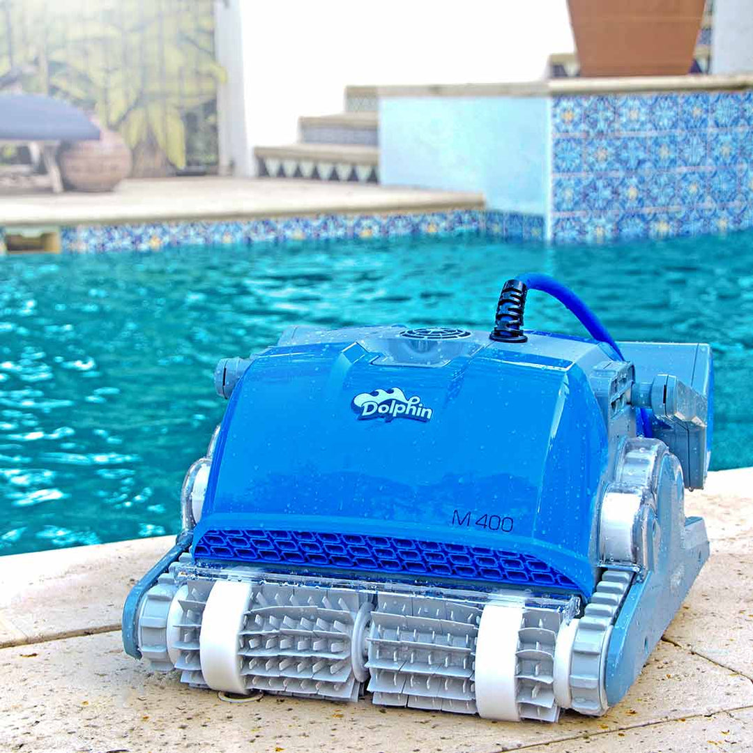 Dolphin M400 Deluxe robotic pool cleaner on the pool deck