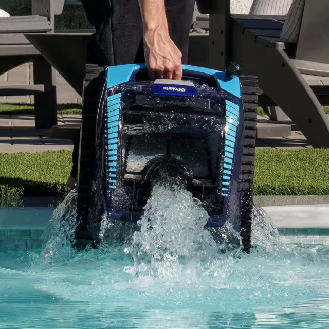 Lifting the Polaris FREEDOM Plus out of the pool at the waterline as water drains out (Easy Lift)